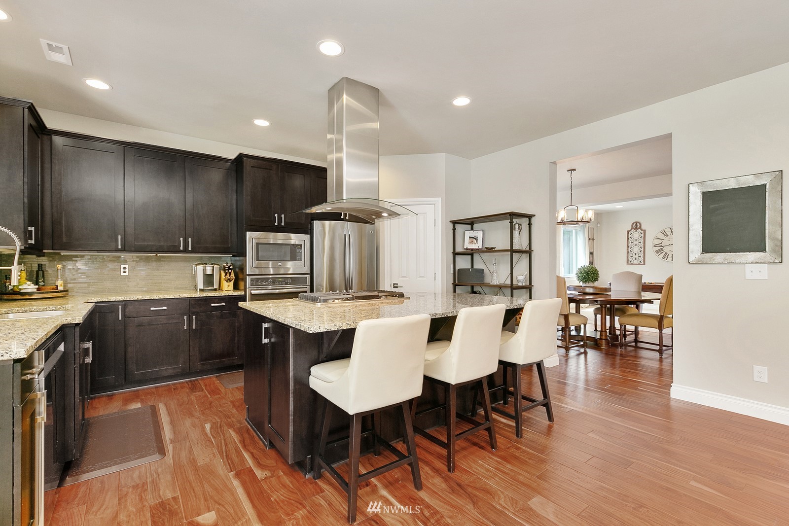 14114 163rd Place Southeast Renton, WA 98059 - Photo 10 of 33 a large kitchen with lots of counter space a sink and chairs