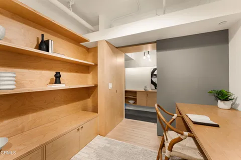 a bedroom with furniture and a potted plant