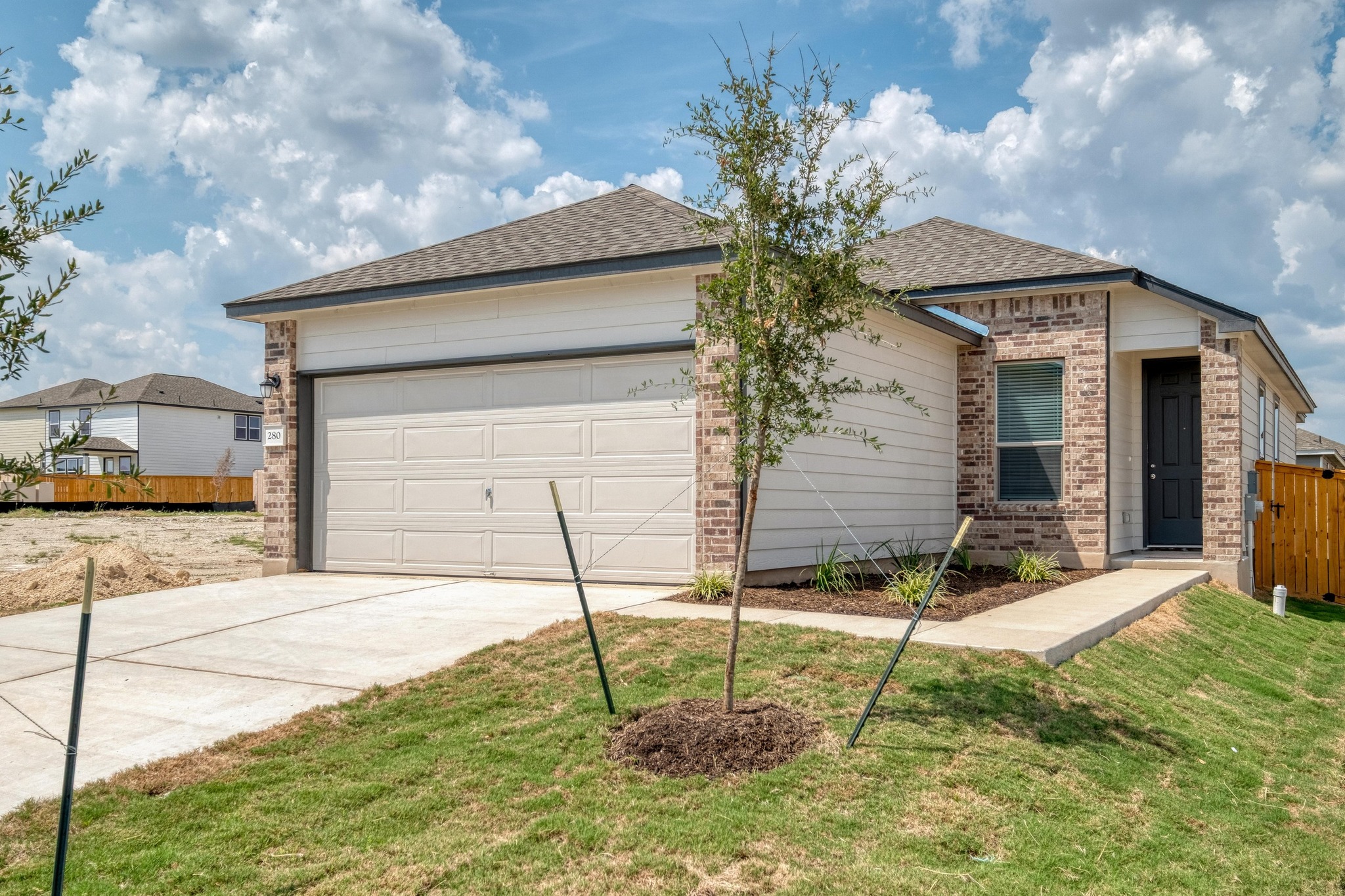 280 Feathers Street Jarrell, TX 76537 - Photo 1 of 26 a house view with a backyard space
