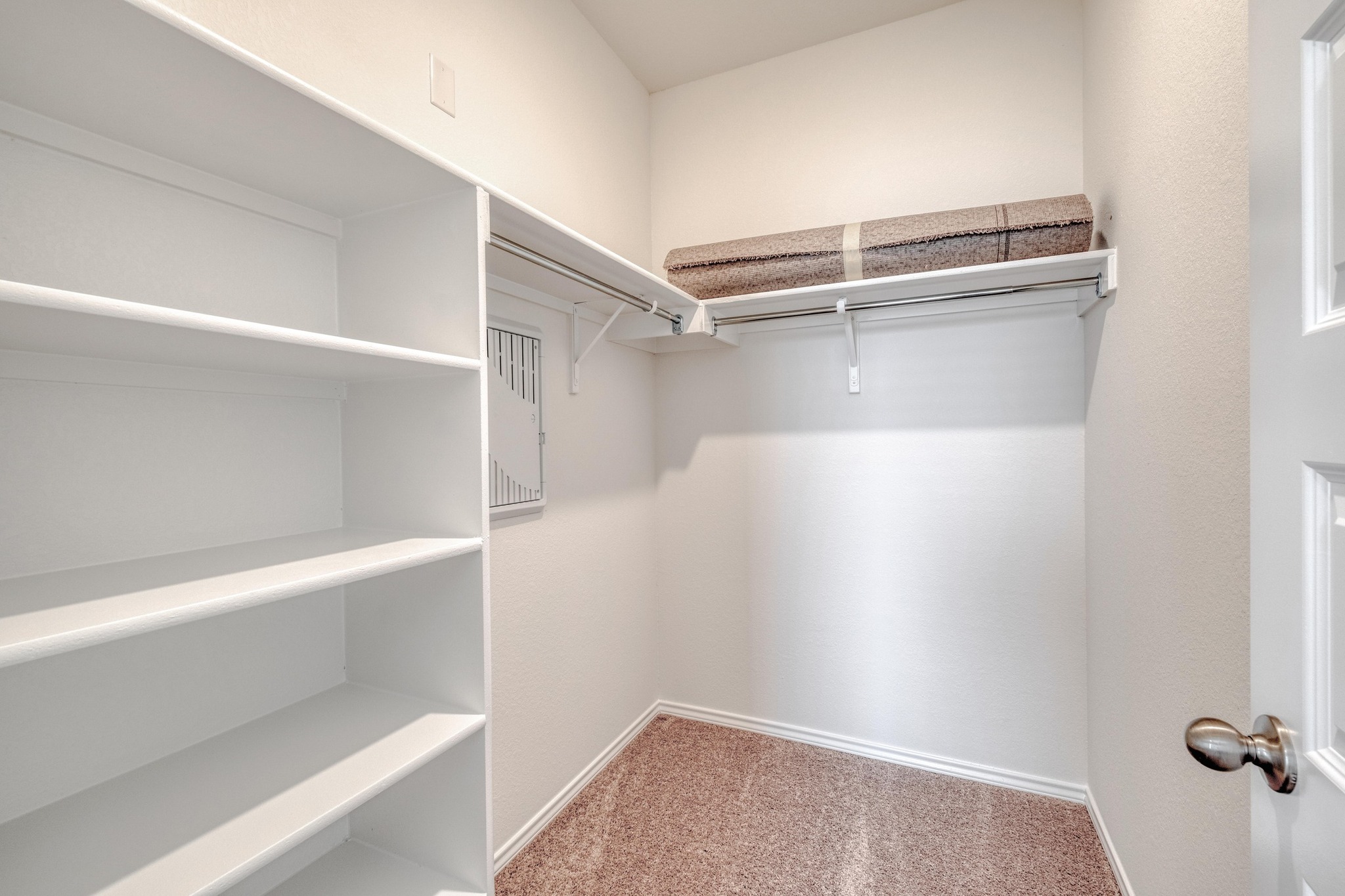 280 Feathers Street Jarrell, TX 76537 - Photo 17 of 26 a view of walk in closet with empty racks