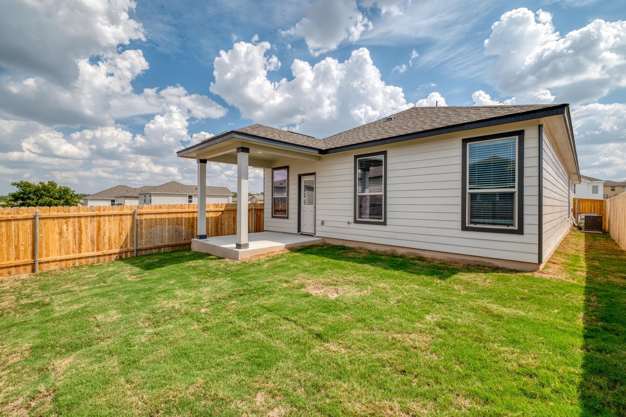 280 Feathers Street Jarrell, TX 76537 - Photo 24 of 26 a view of a house with backyard and porch