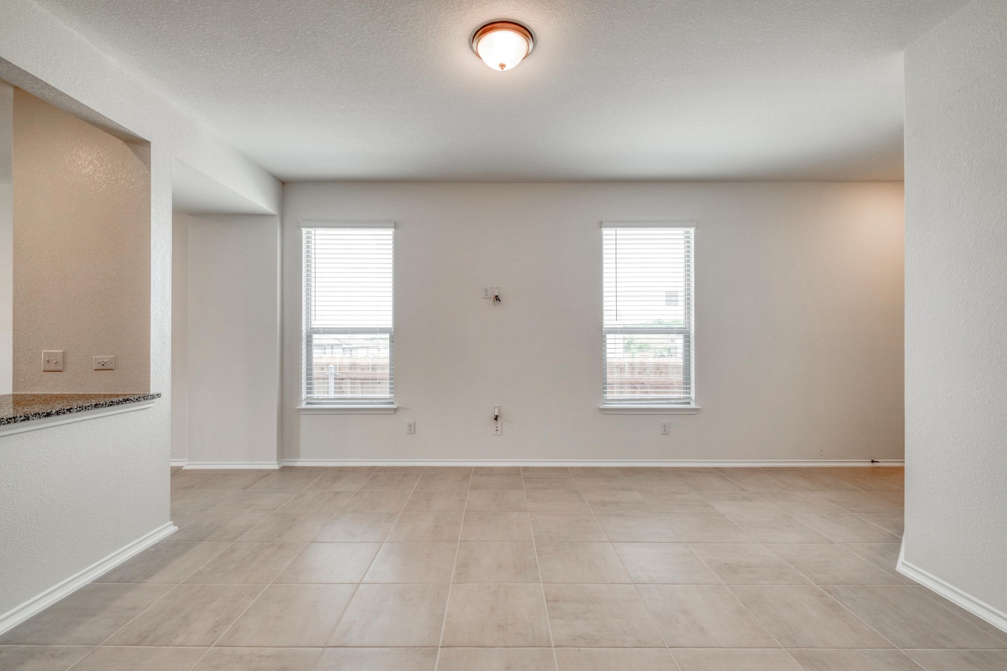 280 Feathers Street Jarrell, TX 76537 - Photo 7 of 26 an empty room with windows