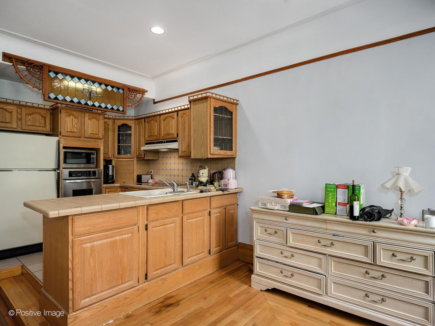 33 East Division Street Chicago, IL 60611 - Photo 25 of 34 a kitchen with stainless steel appliances granite countertop a sink and cabinets
