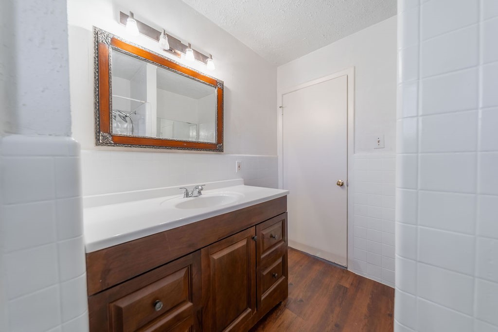 4723 Merwin Street Houston, TX 77027 - Photo 17 of 29 a bathroom with a sink a vanity and a mirror