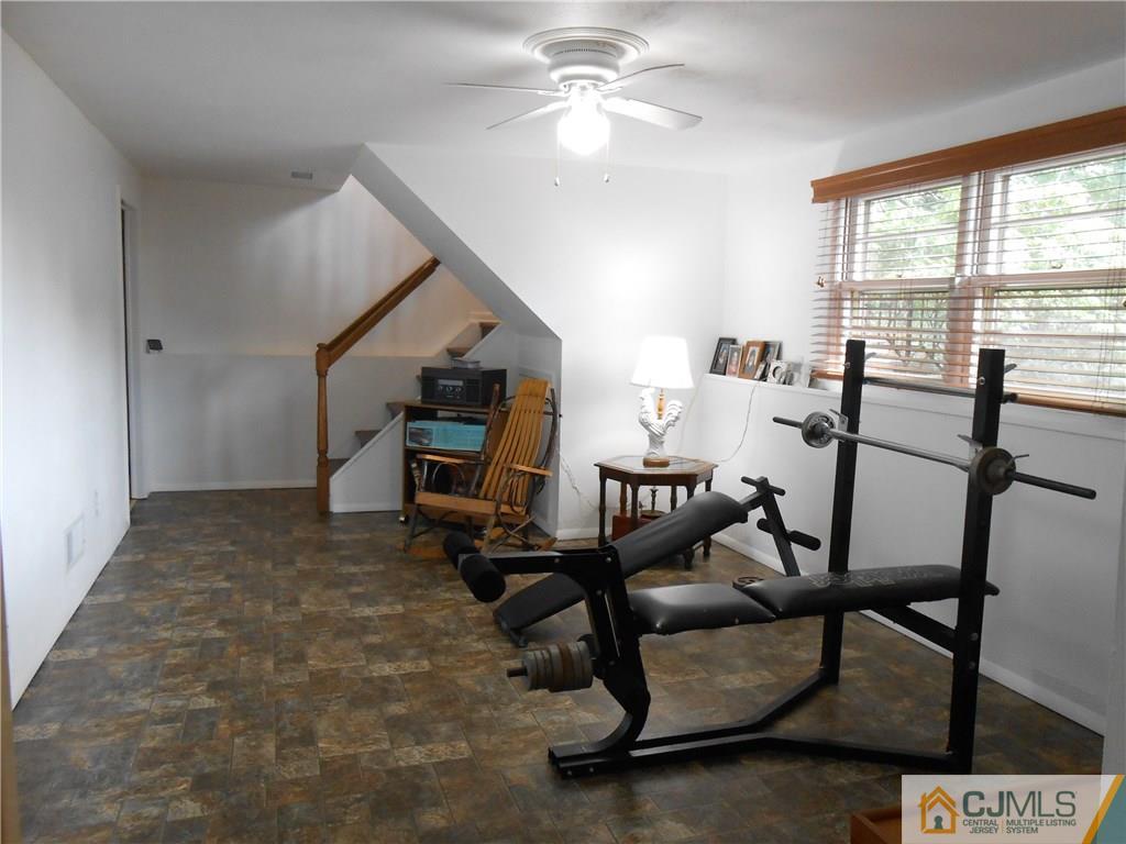 4 Maple Road Iselin, NJ 08830 - Photo 11 of 21 a view of a workspace with furniture and a window