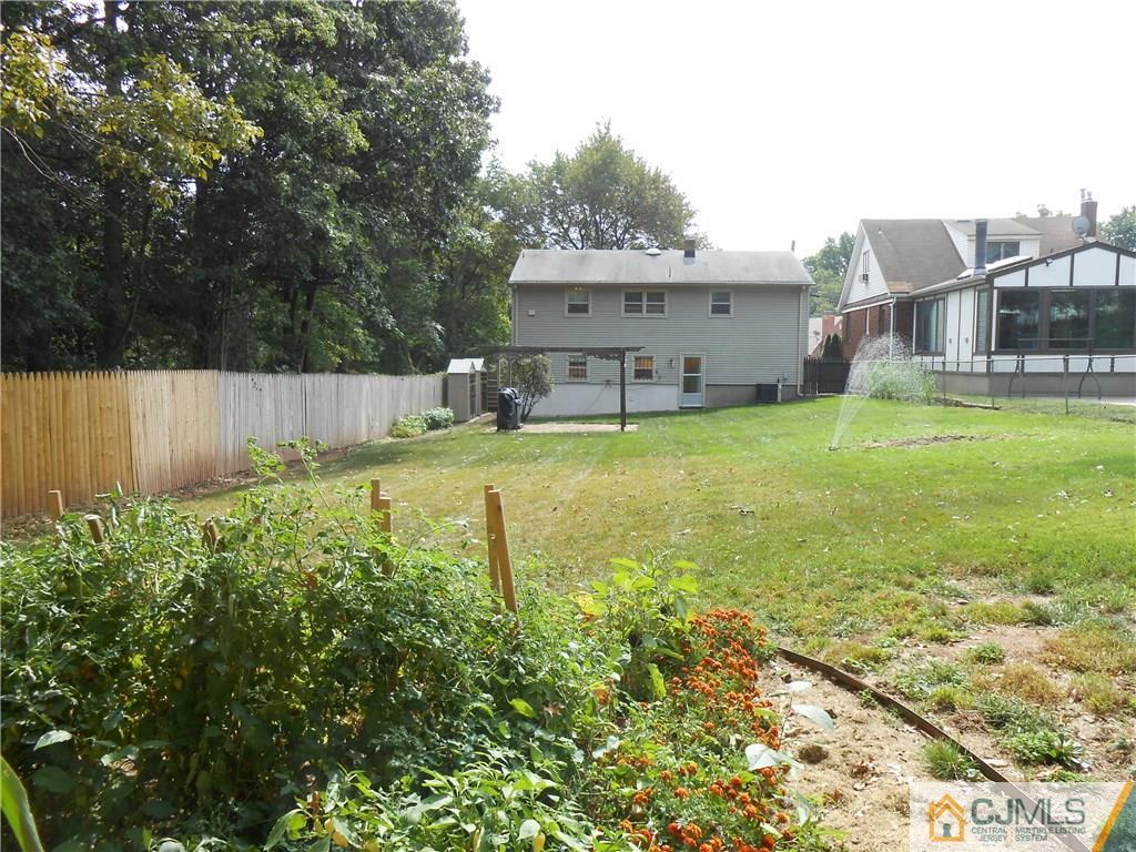4 Maple Road Iselin, NJ 08830 - Photo 15 of 21 a view of a house with backyard and sitting area