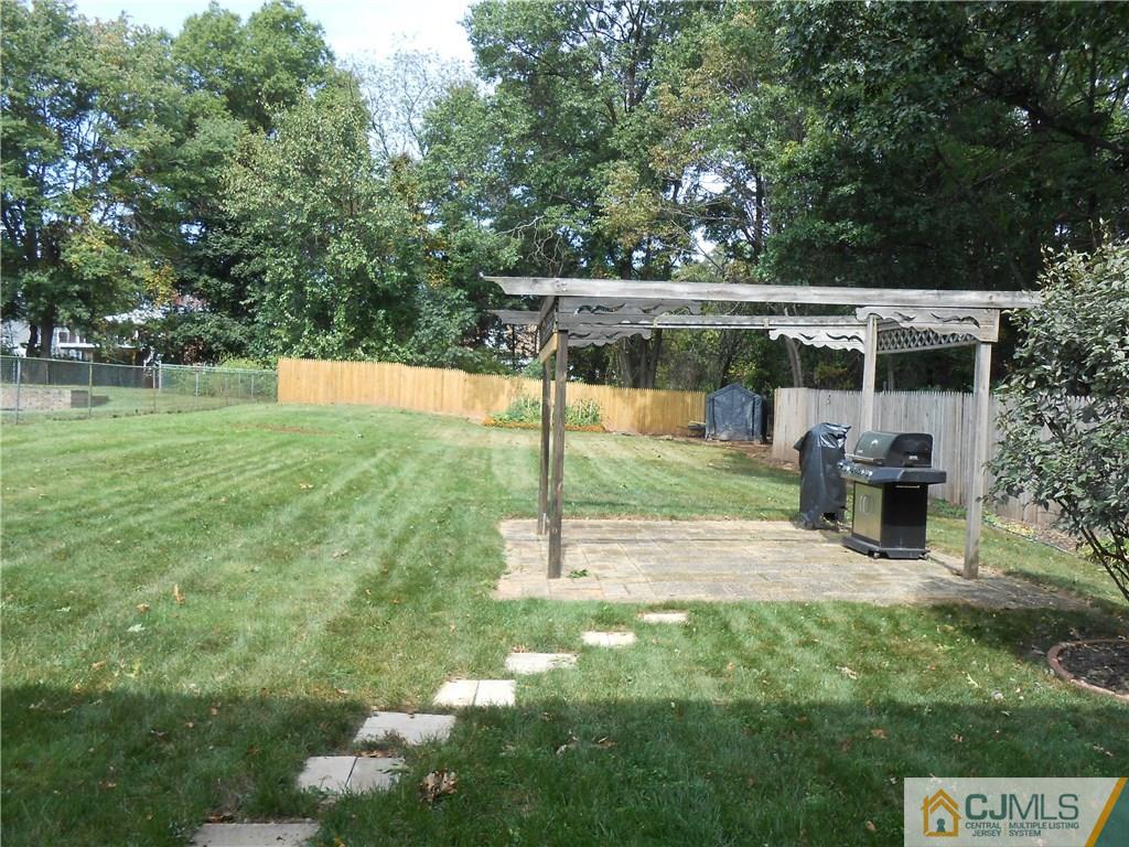 4 Maple Road Iselin, NJ 08830 - Photo 18 of 21 a view of a backyard with sitting area