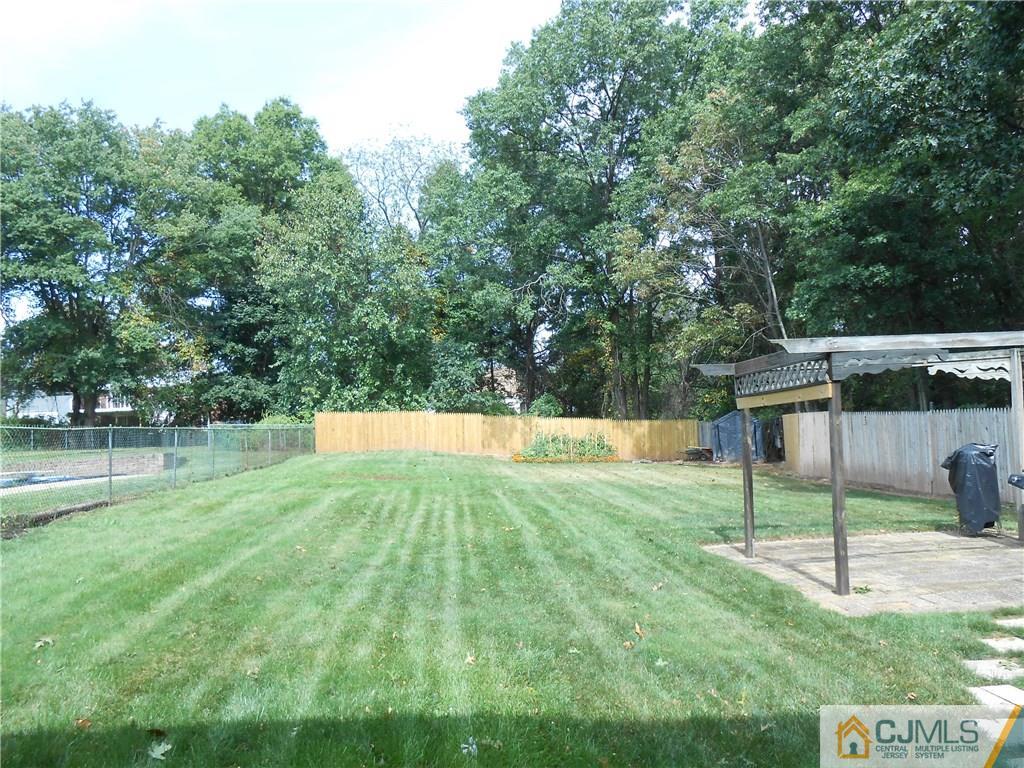 4 Maple Road Iselin, NJ 08830 - Photo 19 of 21 a view of a backyard