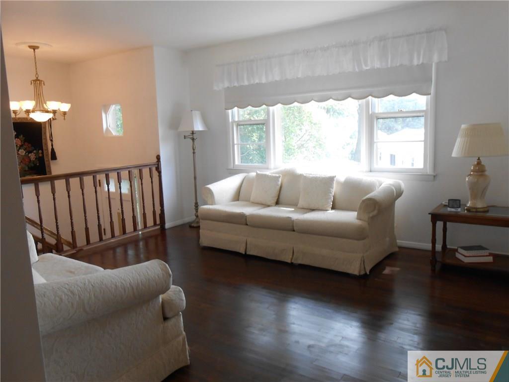 4 Maple Road Iselin, NJ 08830 - Photo 3 of 21 a living room with furniture and a large window