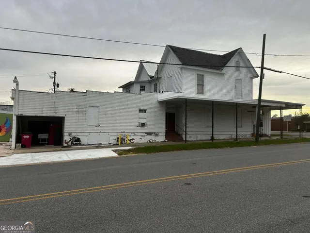 a view of a car park front of house
