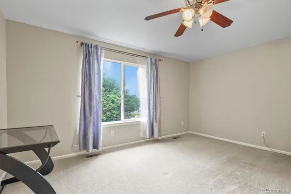 a view of an empty room with a window