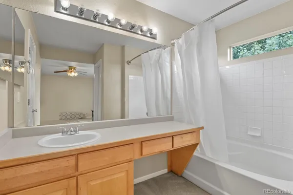 a bathroom with a sink a mirror and a bathtub