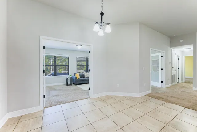 a view of a livingroom with furniture and dining table