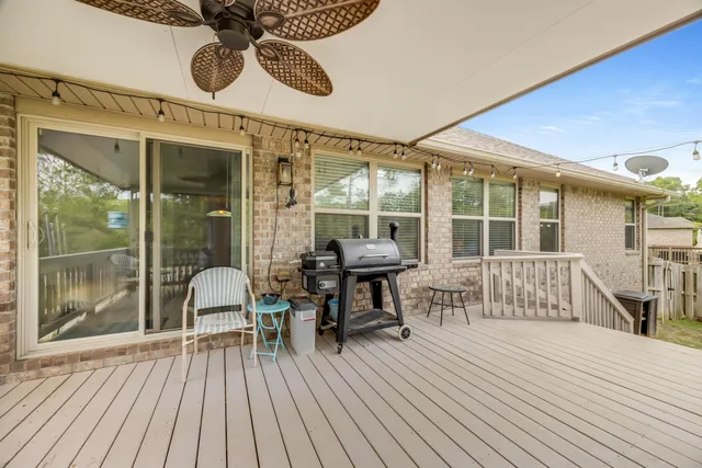 an aerial view of a house with outdoor space