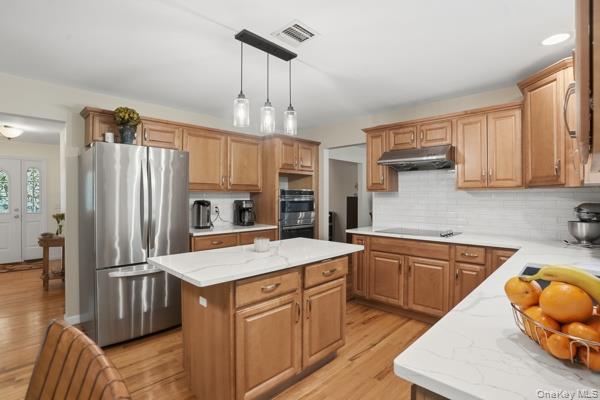 29 Hickory Hill Road Newburgh, NY 12550 - Photo 18 of 47 a kitchen with stainless steel appliances granite countertop a sink refrigerator and cabinets