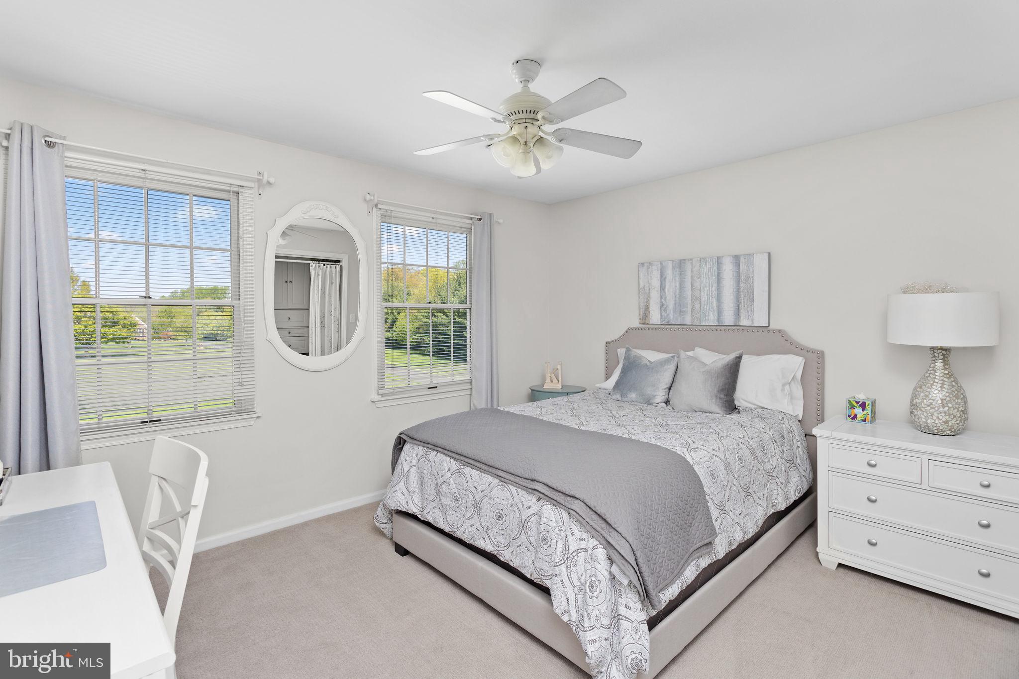44 Walters Road Robbinsville, NJ 08691 - Photo 38 of 68 a bedroom with a large bed and a chandelier