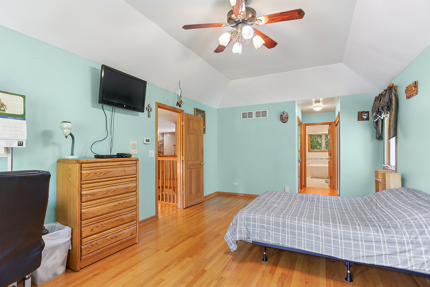 2708 High Meadow Road Naperville, IL 60564 - Photo 17 of 21 a bedroom with a bed and a flat screen tv