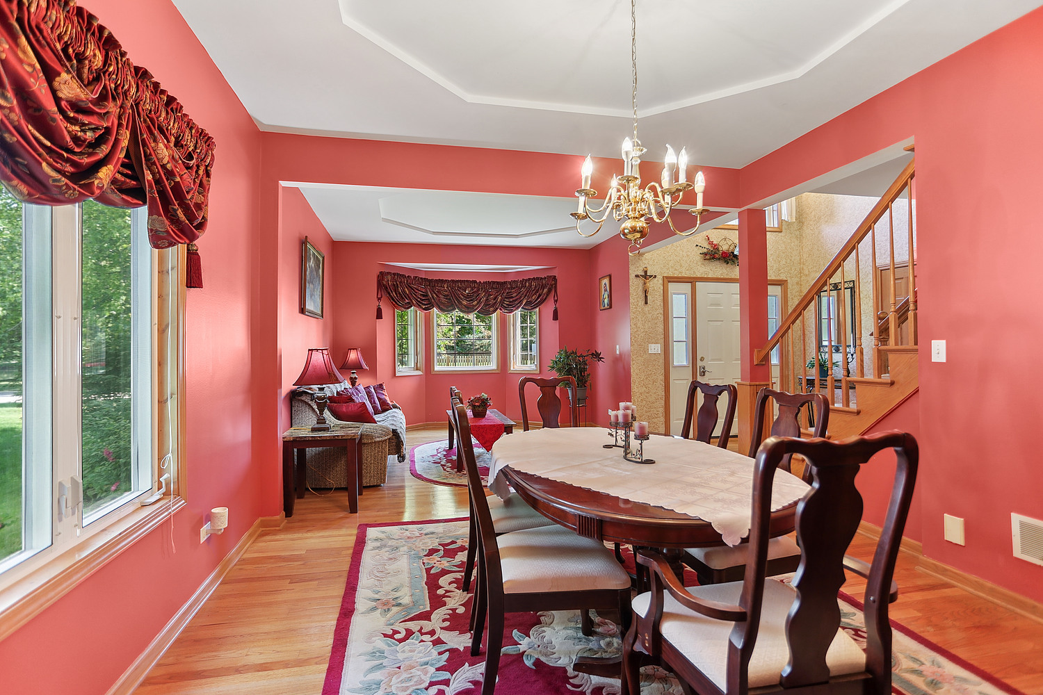 2708 High Meadow Road Naperville, IL 60564 - Photo 4 of 21 a dining room with furniture a chandelier and a rug