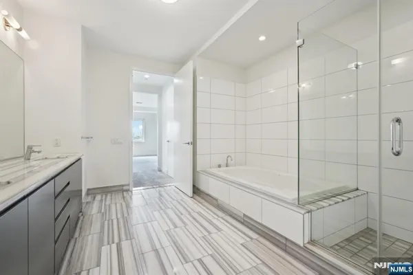 a bathroom with a bathtub and a sink