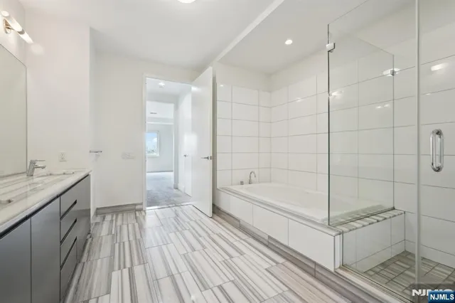 a bathroom with a bathtub and a sink