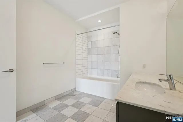 a bathroom with a sink and a bathtub