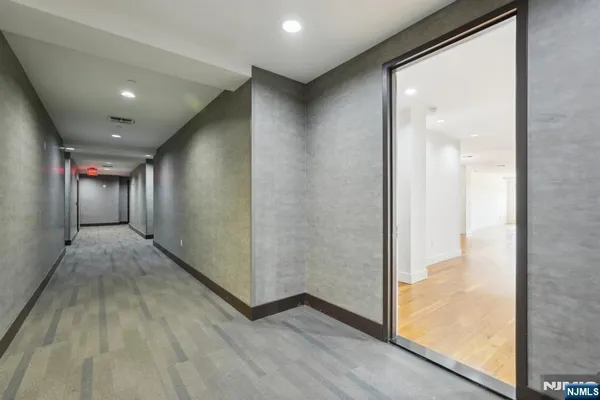 a view of hallway with livingroom
