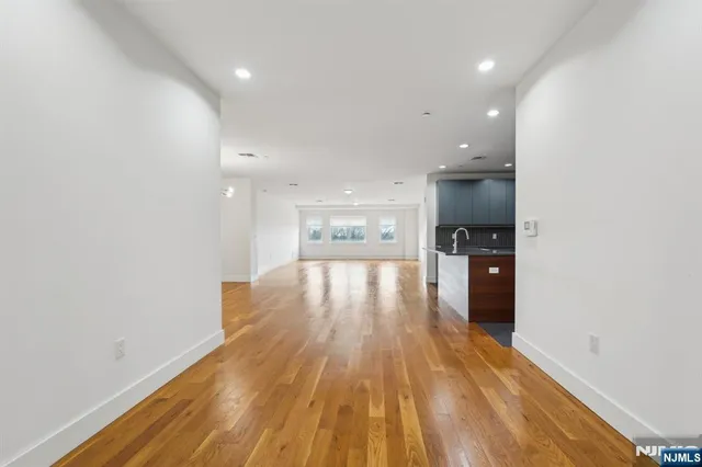 a view of kitchen and wooden floor