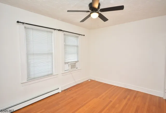 an empty room with a empty space and a window