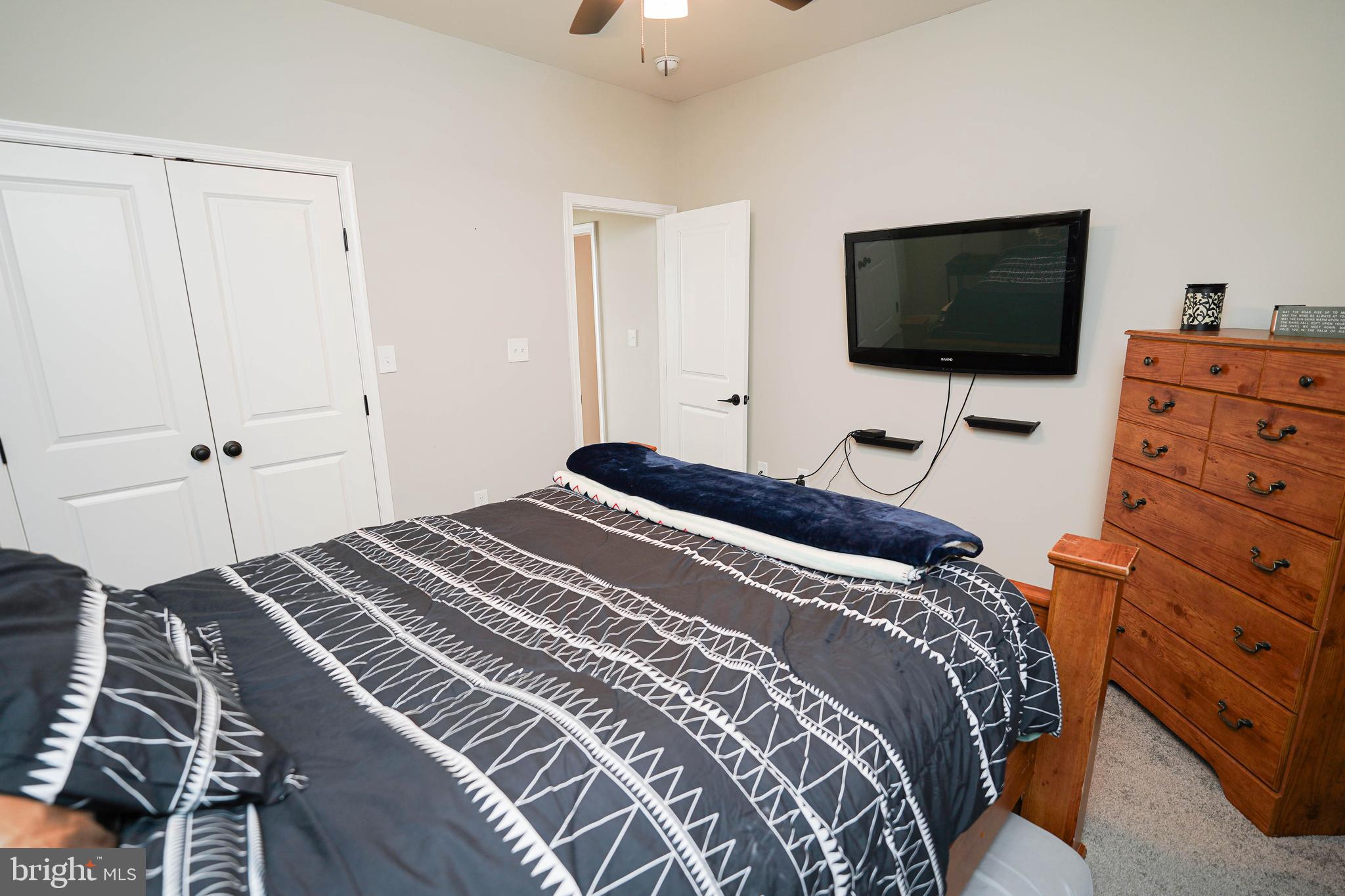2054 Groton Road Pocomoke City, MD 21851 - Photo 28 of 42 a bedroom with a bed and a flat screen tv