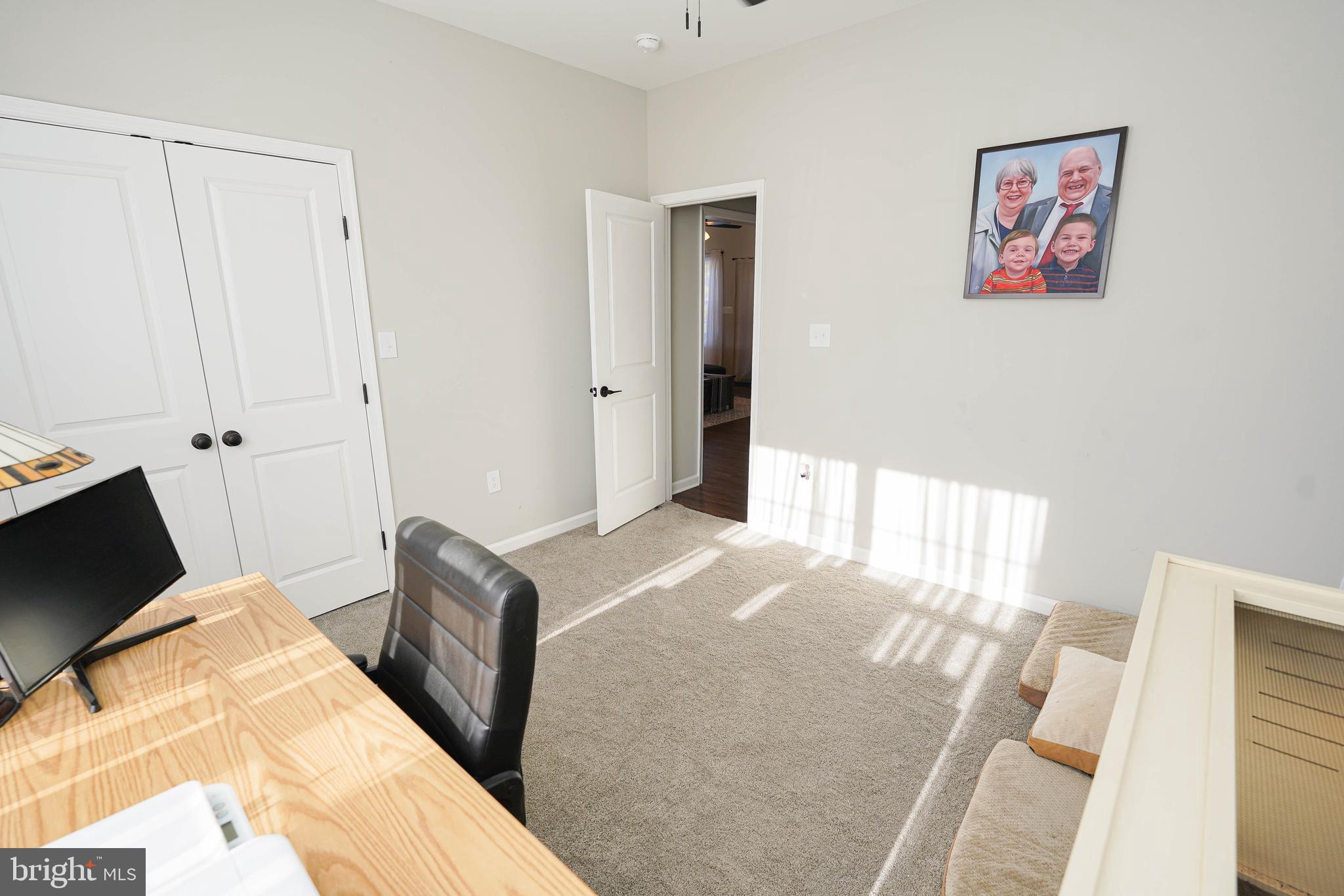 2054 Groton Road Pocomoke City, MD 21851 - Photo 32 of 42 a bedroom with a bed and wooden floor