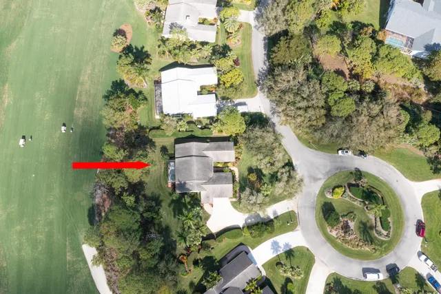 view of a house with a yard and garden