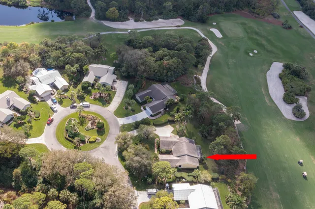 an aerial view of residential house with outdoor space and swimming pool