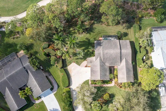 an aerial view of a house with outdoor space