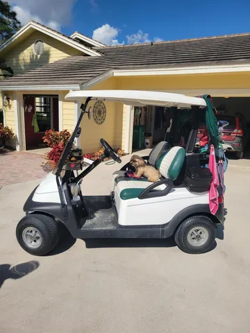 a view of a swimming pool with lounge chairs