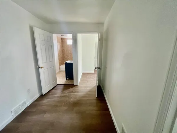 a view of a bathroom from the hallway