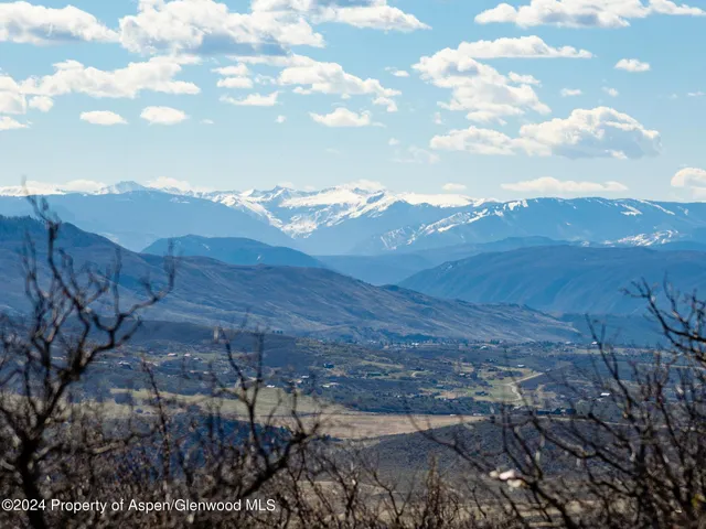a view of a yard with an ocean