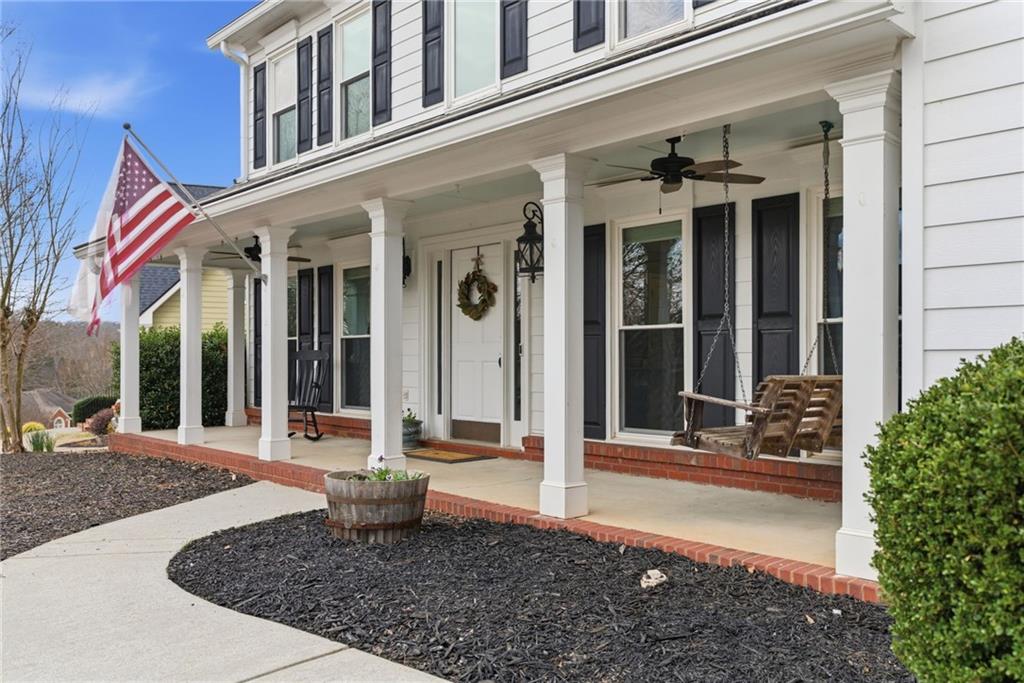 front view of a brick house with a outdoor seating