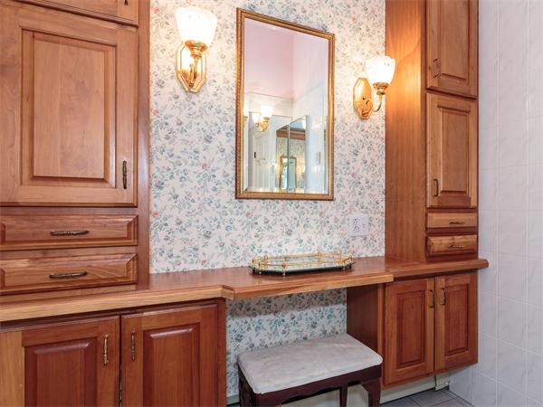 4 Robinhood Road Winchester, MA 01890 - Photo 12 of 26 a bathroom with a sink a mirror and a window