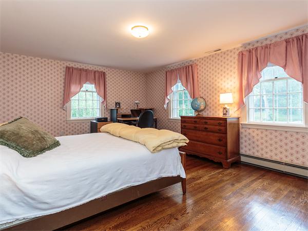 4 Robinhood Road Winchester, MA 01890 - Photo 15 of 26 a bedroom with a bed and window