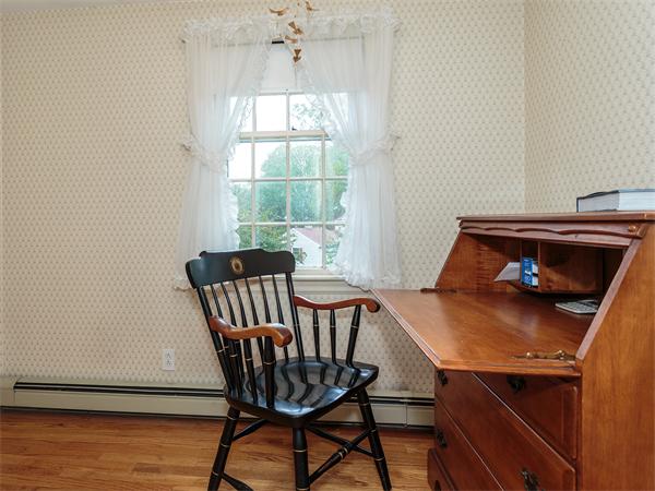 4 Robinhood Road Winchester, MA 01890 - Photo 16 of 26 a view of a dining room with furniture window and wooden floor