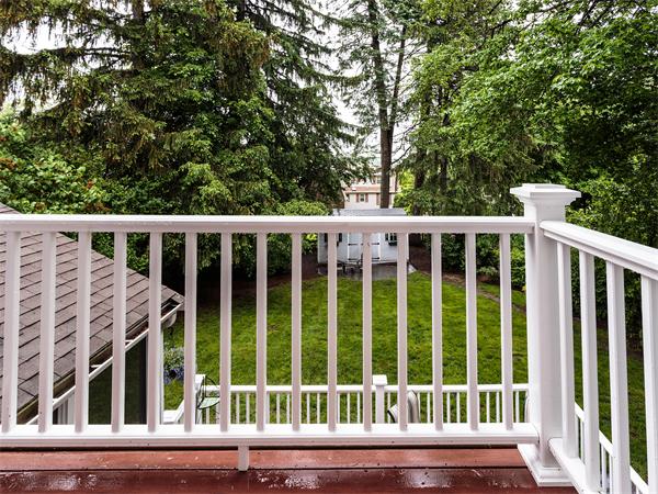 4 Robinhood Road Winchester, MA 01890 - Photo 24 of 26 a view of a wooden balcony with trees