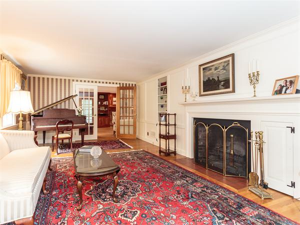 4 Robinhood Road Winchester, MA 01890 - Photo 3 of 26 a living room with furniture a rug and a fireplace