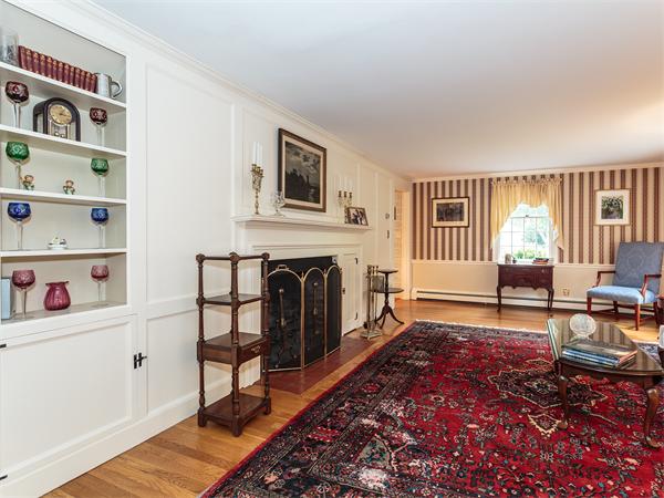4 Robinhood Road Winchester, MA 01890 - Photo 4 of 26 a living room with furniture and a fireplace