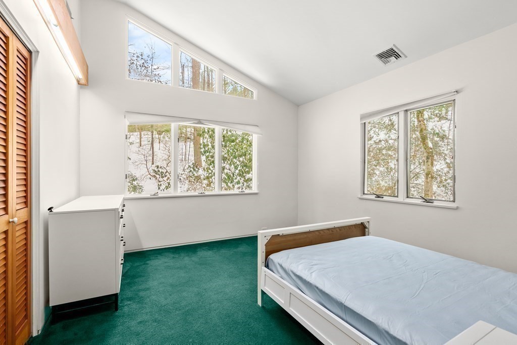 9 Valley View Road Weston, MA 02493 - Photo 16 of 30 a bed room with a bed and a window