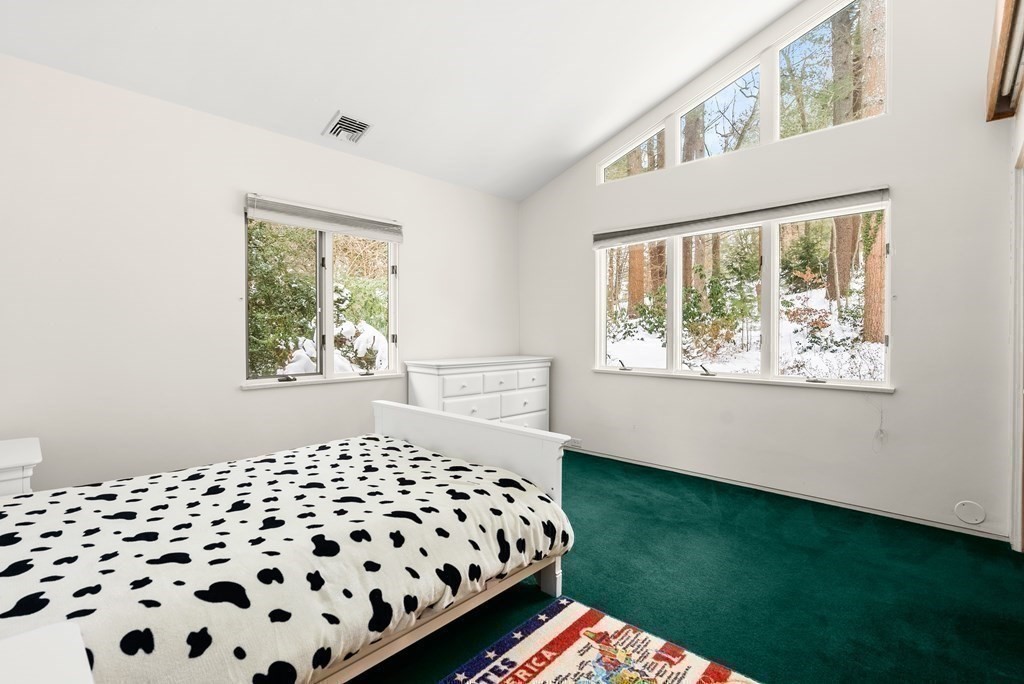 9 Valley View Road Weston, MA 02493 - Photo 18 of 30 a bedroom with a bed and a window