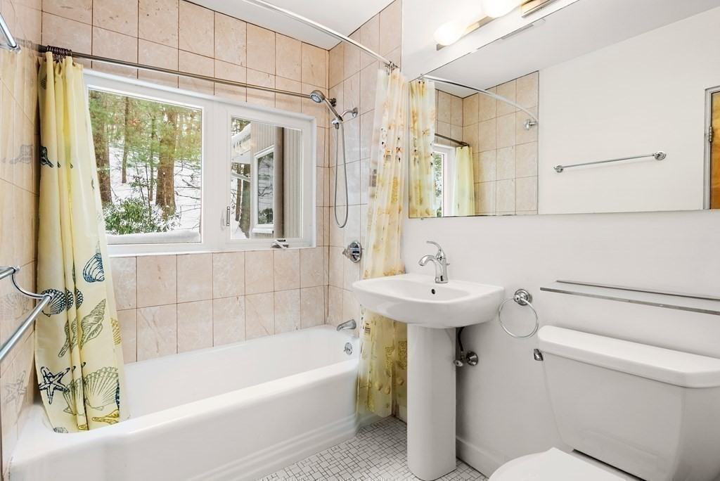 9 Valley View Road Weston, MA 02493 - Photo 21 of 30 a bathroom with a sink a toilet and shower
