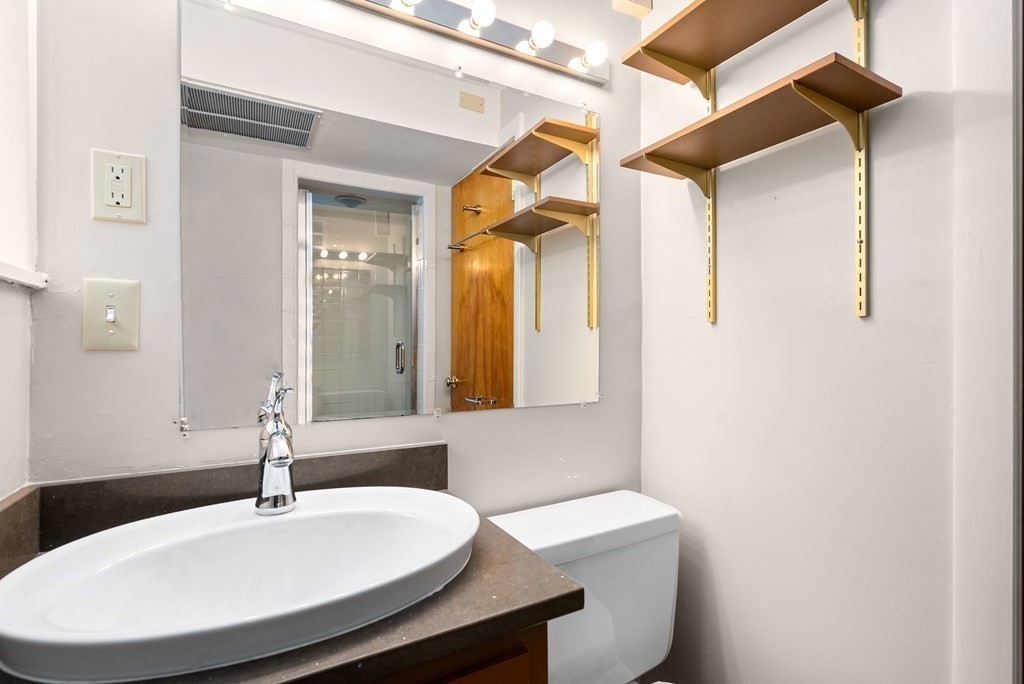 9 Valley View Road Weston, MA 02493 - Photo 24 of 30 a bathroom with a sink and a mirror