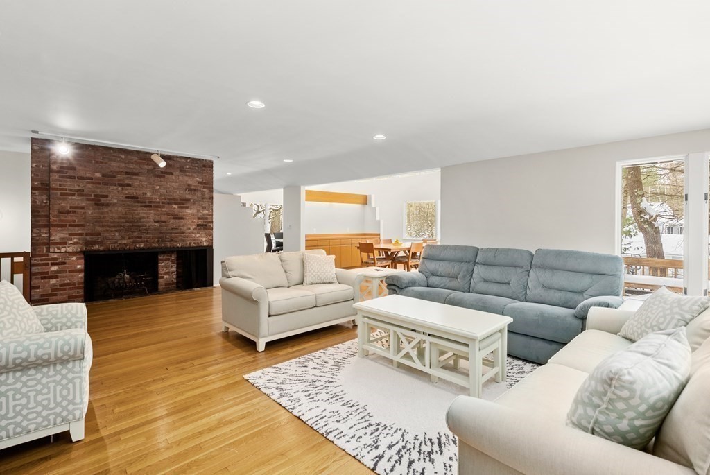 9 Valley View Road Weston, MA 02493 - Photo 3 of 30 a living room with furniture and a fireplace