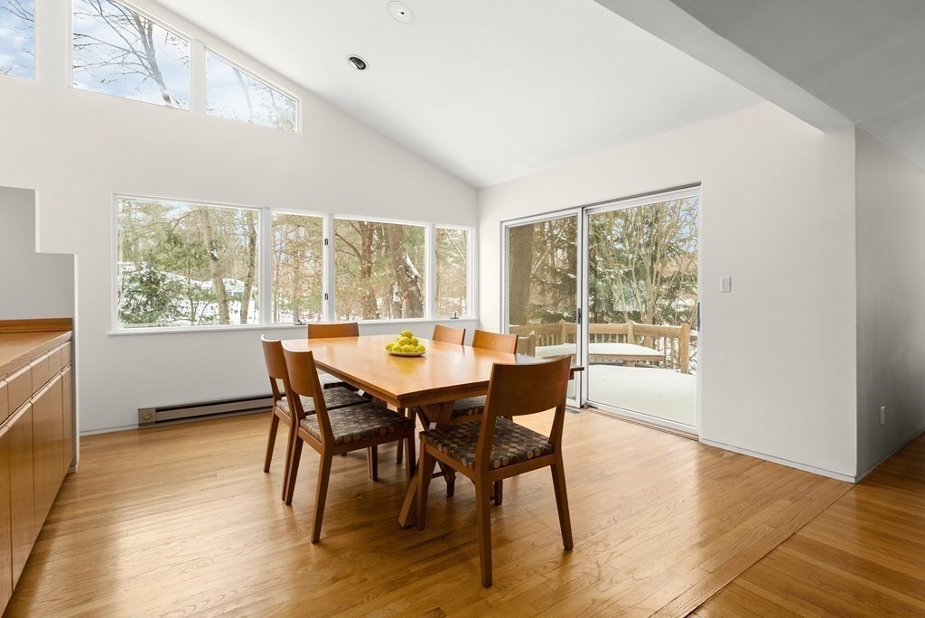 9 Valley View Road Weston, MA 02493 - Photo 6 of 30 a view of a dining room with furniture and wooden floor