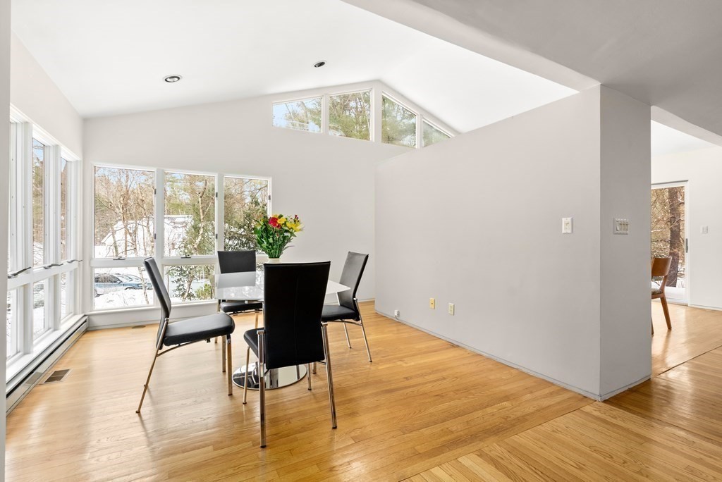 9 Valley View Road Weston, MA 02493 - Photo 7 of 30 a view of a dining room with furniture and wooden floor